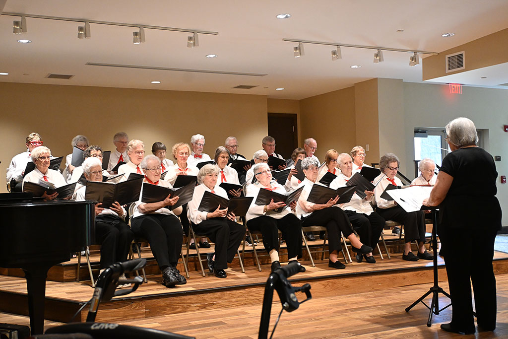 The Phoebe Choraleers, dressed in brilliant white outfits, perform at the Phoebe Berks Spring Musicale.