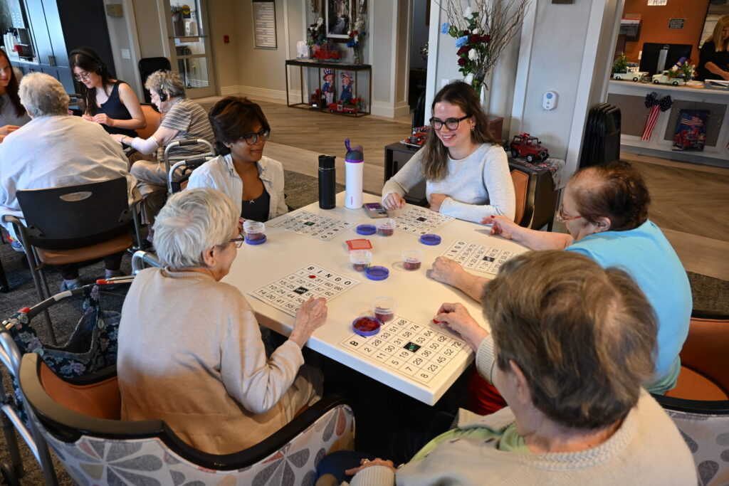 Muhlenberg students gather around for bingo with Miller residents.