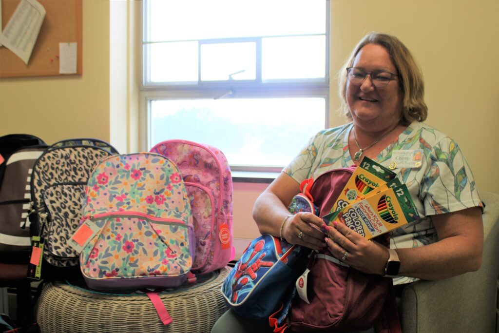Chaplain Chera Wertz with school supplies.