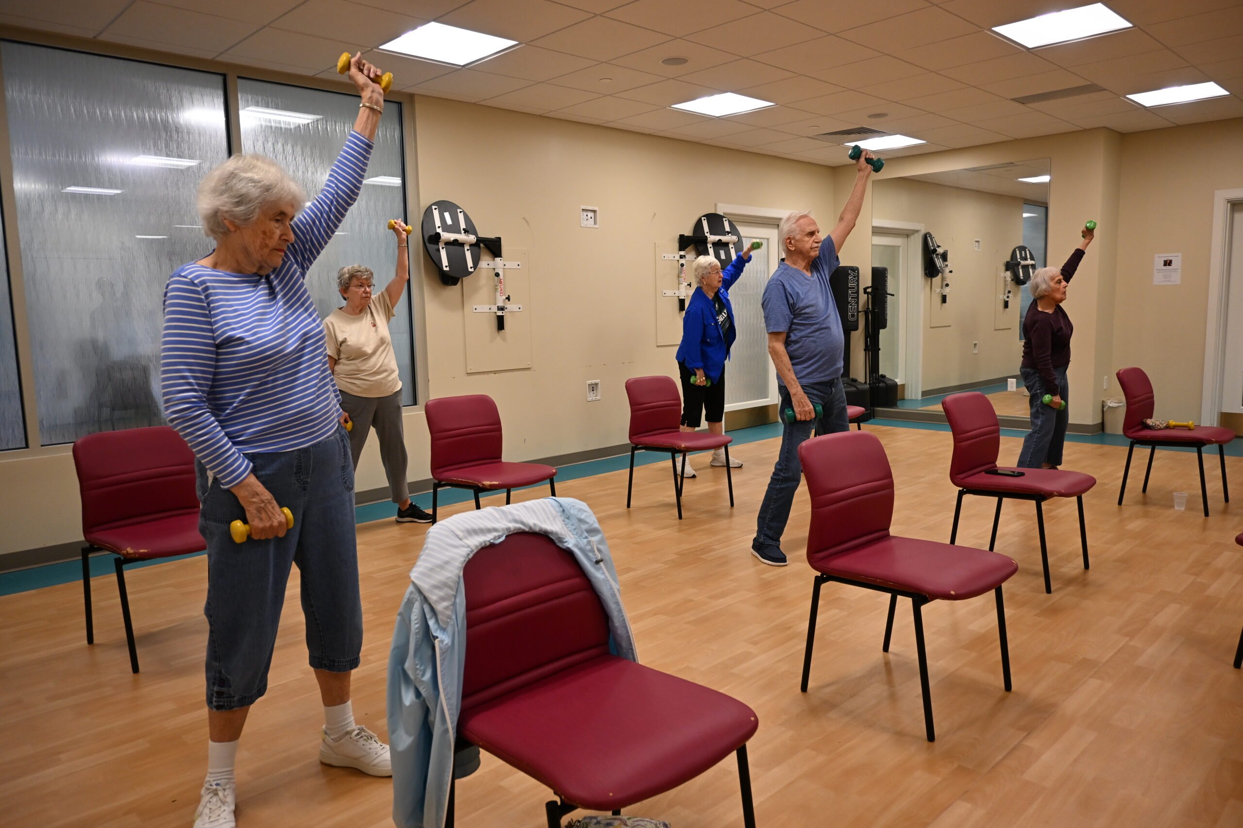 Residents exercising in the aerobics room of Phoebe Berks with Instructor Joel Moceri.