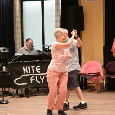 couple-dancing-in-front-of-band_small