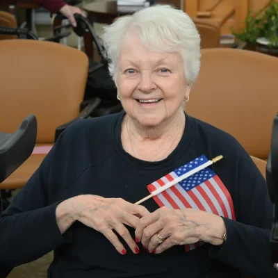 resident-holding-flag_small